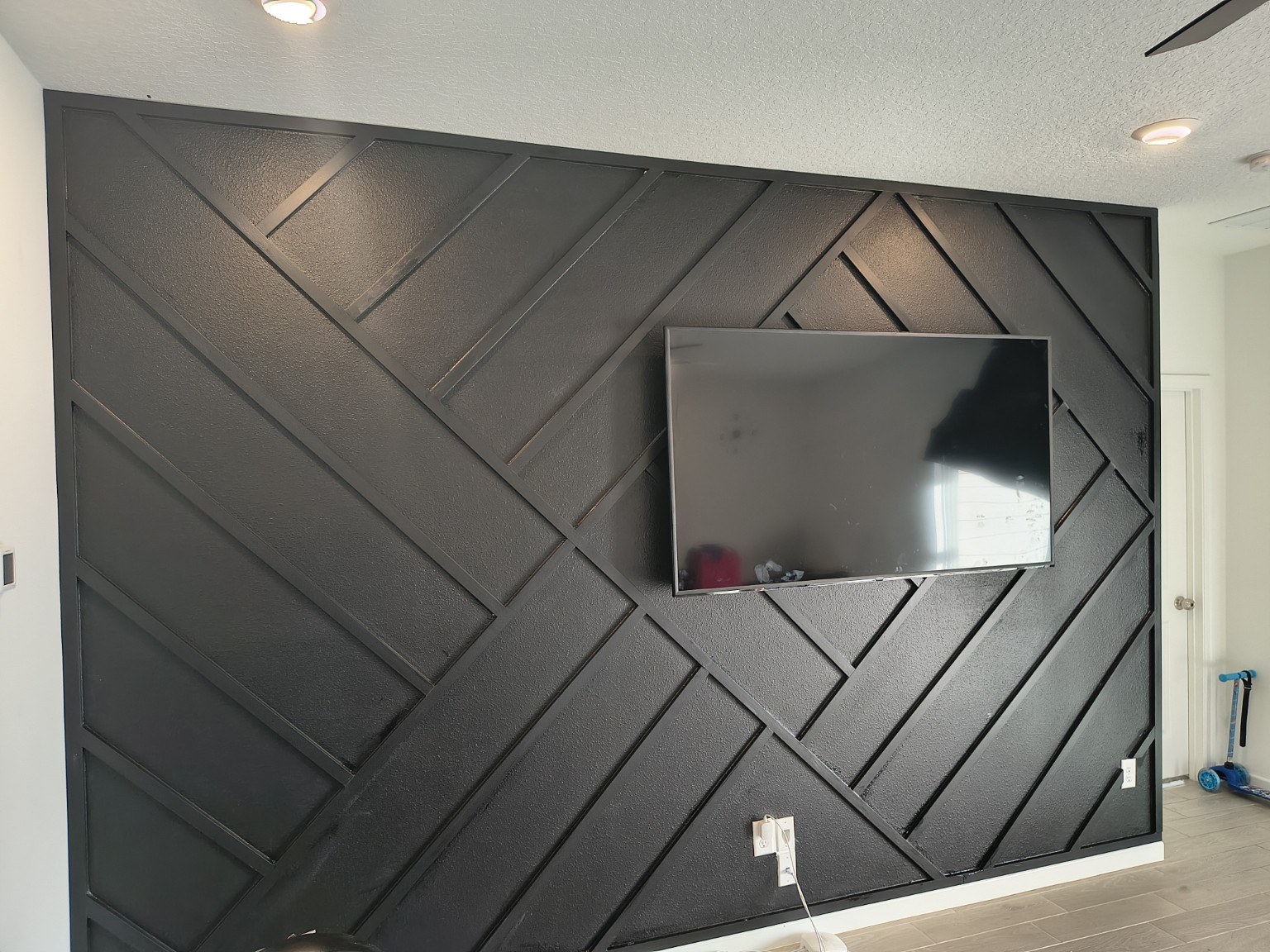 Charcoal geometric media wall